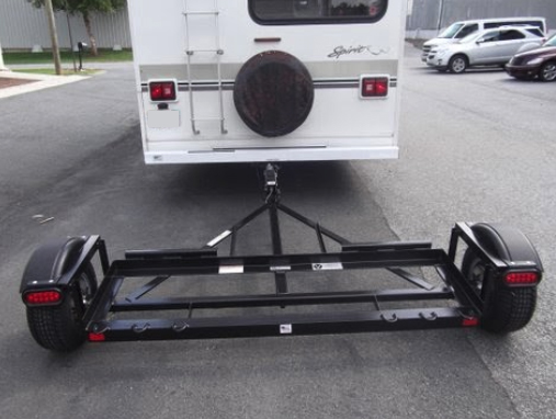 What’s the Difference Between a Tow Bar and Tow Dolly?